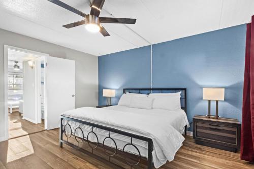 a bedroom with a bed and a ceiling fan at Sunset Beach Suite 2 in St Pete Beach