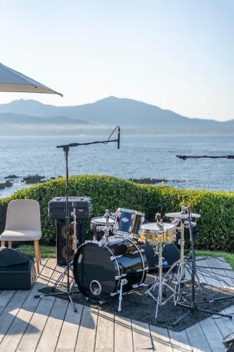 a drum set sitting on the ground next to the water at Sofitel Golfe d'Ajaccio Thalassa Sea & Spa in Ajaccio