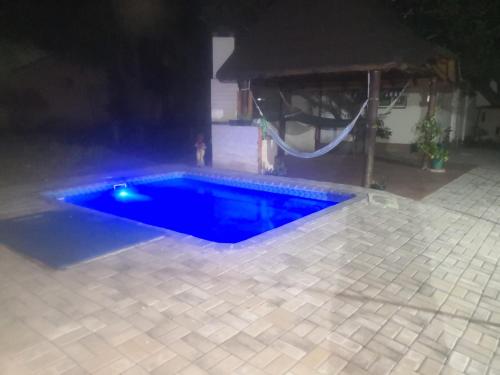 a swimming pool in a backyard at night at 15 On Reitz Bela bela in Bela-Bela