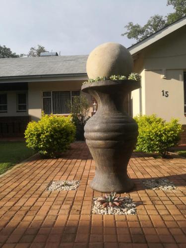 a statue in the yard of a house at 15 On Reitz Bela bela in Bela-Bela