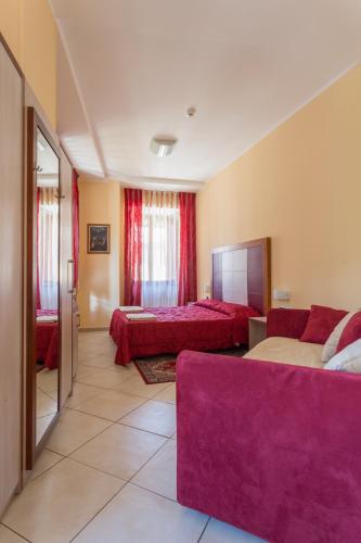 Una cama o camas en una habitación de Hotel Conte Ruggero