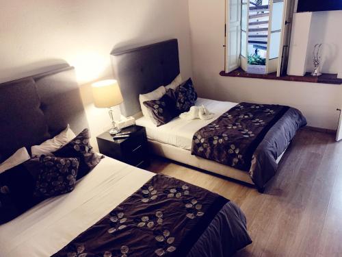 Säng eller sängar i ett rum på M Hoteles Concepto