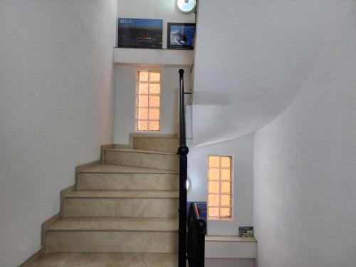 a spiral staircase with a window in a house at Apartments Ohrid Lake in Ohrid