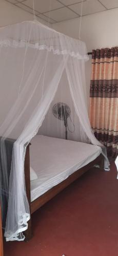 Postel nebo postele na pokoji v ubytování New Cinnamon Garden