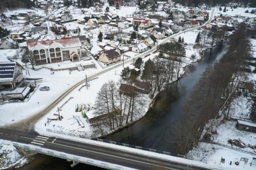 an aerial view of a town in the snow at Chaber Apartamenty in Swornegacie 