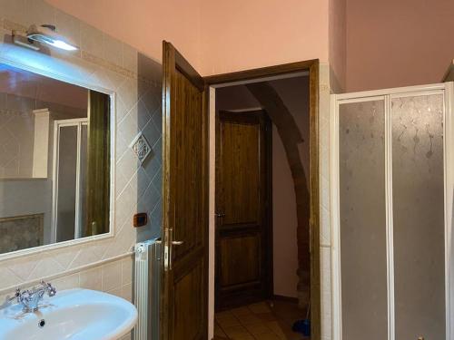 a bathroom with a sink and a mirror at Agriturismo Relais Villa Passerini in Grosseto