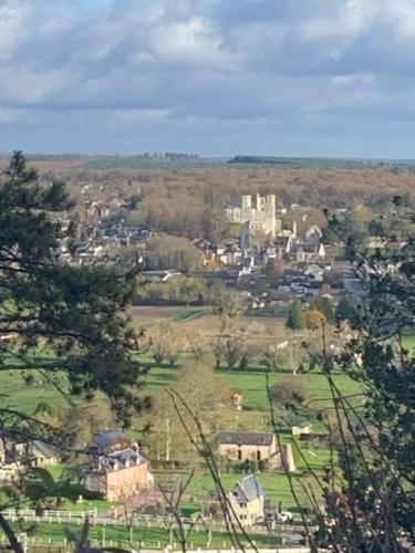 a view of a town with a city in the distance at 3)Maison tout confort boucle de la Seine in Duclair