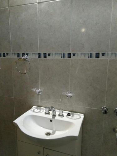 a bathroom with a white sink and a shower at Casa en Amaicha in Amaicha del Valle