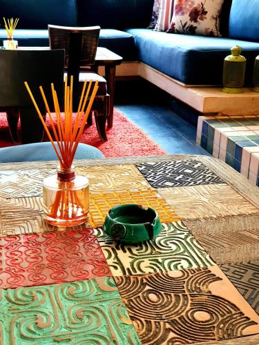 a table with a vase on top of a table at Casa Taos in Marrakech