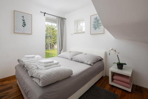 Postel nebo postele na pokoji v ubytování Villa Perla