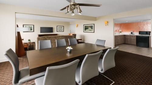 a dining room and kitchen with a table and chairs at Crowne Plaza Phoenix Airport - PHX by IHG in Phoenix