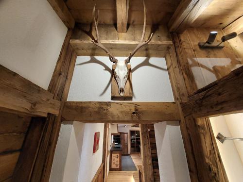 a deer head hanging from the ceiling of a room at Wieserhof Tirol in Oetz