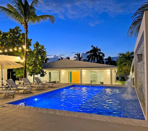 a swimming pool in front of a house at Zaba Beach House in San Andrés