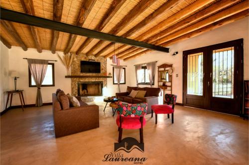 a large living room with a wooden ceiling at Villa Laureana in Huacalera