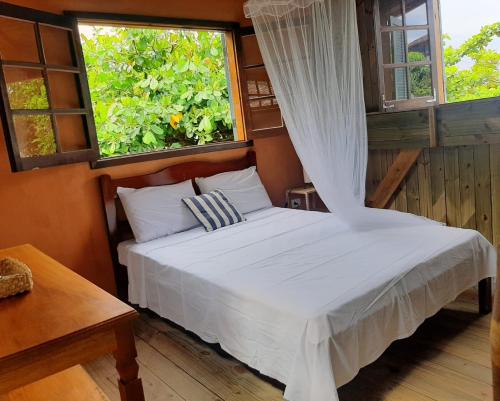 Cama o camas de una habitación en Vila Angatu