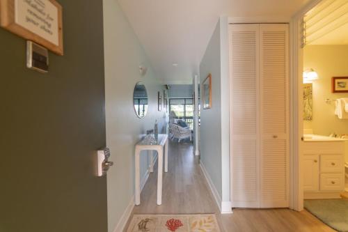 a hallway with a staircase leading to a house at NorthShore Haven Condo in Kahuku