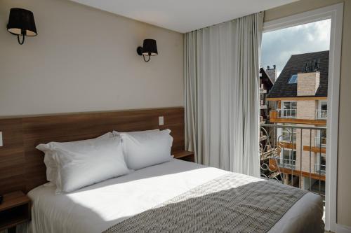 Postel nebo postele na pokoji v ubytování Augusta Centro Hotel