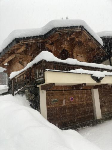 a snow covered roof of a house with snow on it at Chalet Dufour in Morzine