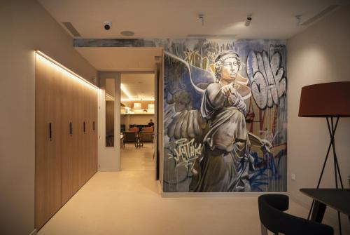a mural on the wall of a hallway at Mythic Valencia in Valencia
