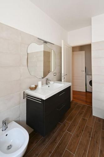 a bathroom with a sink and a mirror at [Casa Gisa]Splendida terrazza nel cuore del centro in Città di Castello