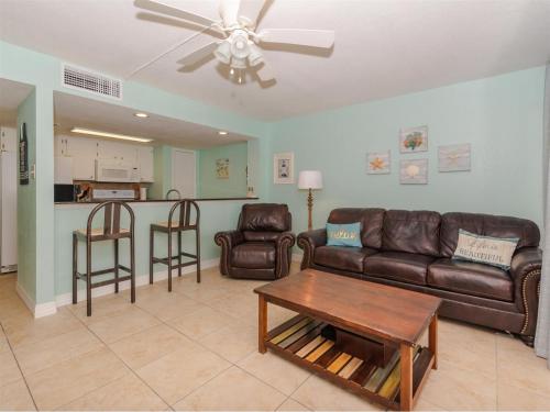 a living room with a couch and chairs and a table at Laguna Reef #214 - Retreat on Rockport Bay in Rockport