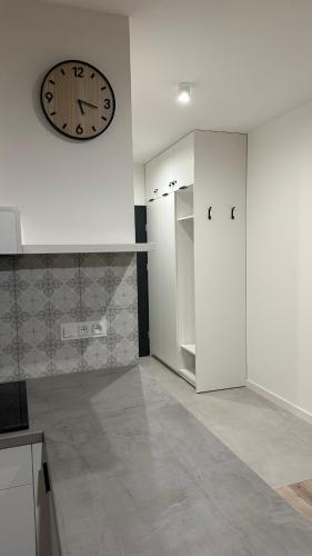 Η κουζίνα ή μικρή κουζίνα στο Apartamenty Mickiewicza40