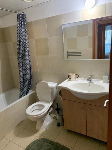 a bathroom with a toilet and a sink at Beautiful apartment in center of Jerusalem in Jerusalem