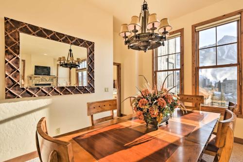 a dining room with a table and a mirror at Crested Butte Townhome with Views - Steps to Lifts! in Mount Crested Butte