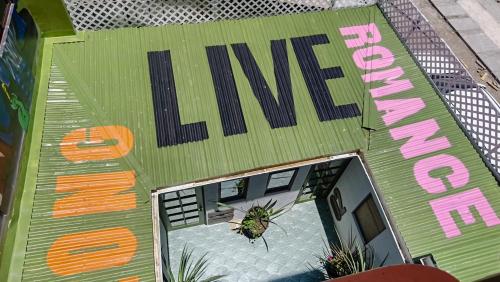 an overhead view of a building with a sign that reads live at hotel velero cavancha in Iquique