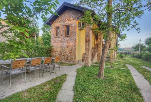 a table and chairs in front of a building at Danube fairy in Futog