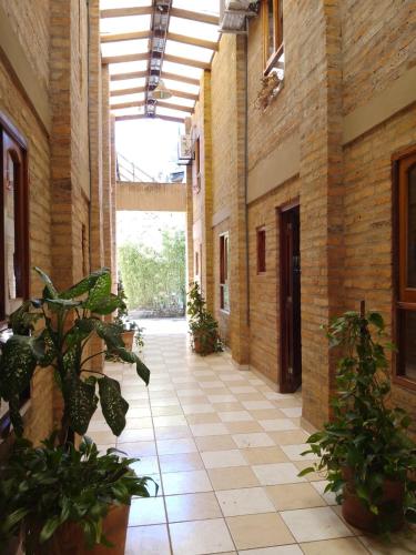 an empty hallway with potted plants in a building at DEPARTAMENtO LOFT in Posadas