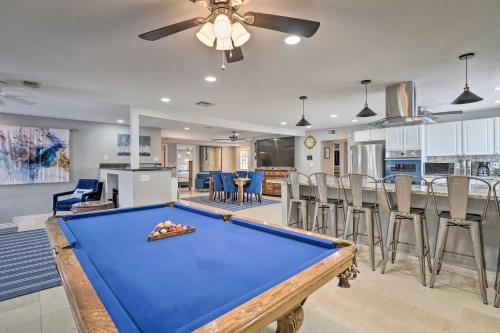 a living room with a pool table and a kitchen at Home with Private Pool - Near Las Vegas Strip! in Las Vegas