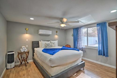 a bedroom with a bed and a ceiling fan at Home with Private Pool - Near Las Vegas Strip! in Las Vegas