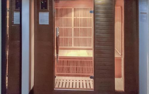 a glass door of a building with a balcony at 3 Bedroom Amazing Home In Bannalec in Bannalec