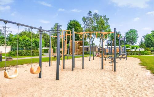 a playground in a park with a slide at Awesome Home In Heinkenszand With Wifi in Heinkensand