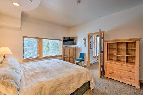 a bedroom with a large bed and a desk at Ski-InandSki-Out Solitude Condo with Rooftop Hot Tub! in Salt Lake City