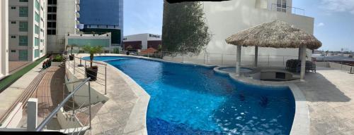 Bazén v ubytování Departamento con alberca en Torre Boca Towers nebo v jeho okolí