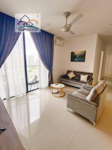 a living room with a couch and a table at D'Pristine Design Apartment by TGP in Nusajaya