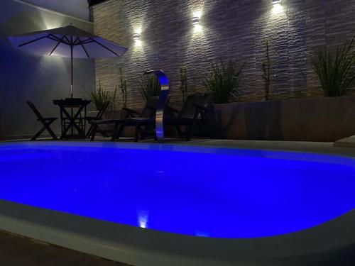 Foto Casa com piscina e um quarto com ar split pé na areia a 50 metros da praia 1