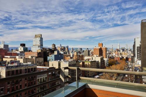 a view of the city from the balcony of a building at Kasa Lantern Lower East Side in New York