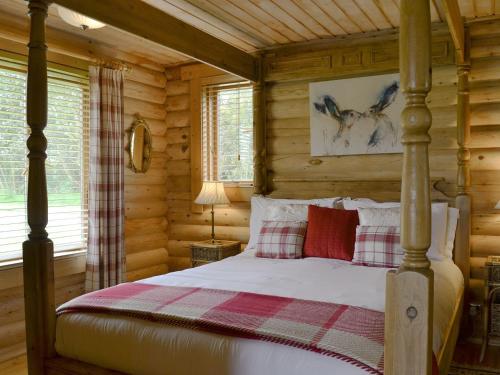 En eller flere senge i et værelse på Lepus Lodge - E3731