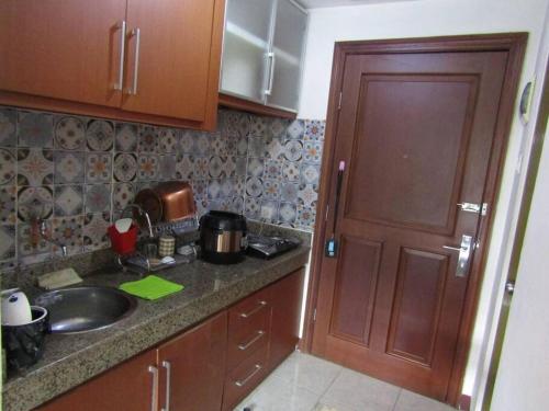 a kitchen with a sink and a counter top at Quiet Room Near UNPAR, ITB. Ideal for students in Bandung