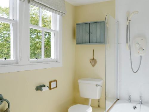 a bathroom with a toilet and a shower at Islabank Farmhouse - Saap in Kirkton of Airlie