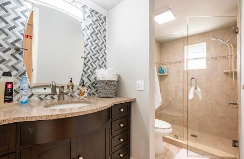 a bathroom with a sink and a shower at Jony’s Oasis in Naples