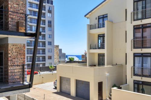 a view from the balcony of a apartment building at Manhattan On Coral Apartments in Bloubergstrand