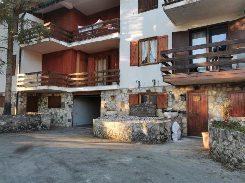 a large building with a porch and a balcony at Casa Vacanza Pescocostanzo in Pescocostanzo