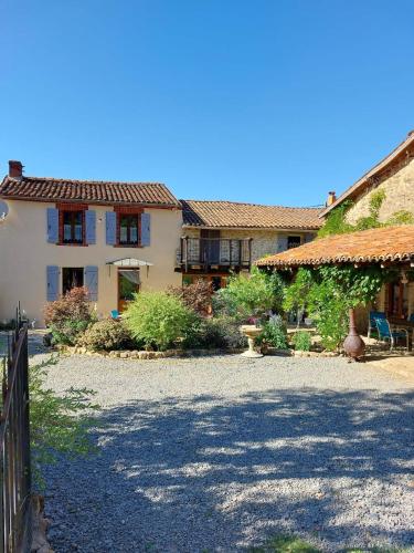 a large house with a fence and a gravel driveway at Lazy Days in Rancon