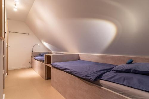 Ein Bett oder Betten in einem Zimmer der Unterkunft HYGGE unter Reet