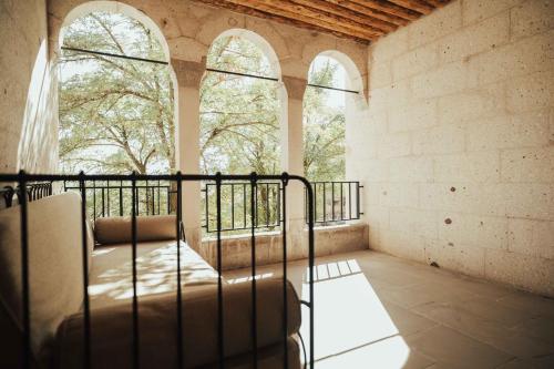 a room with a bed and two windows at Hu of Cappadocia - Special Class in Uchisar