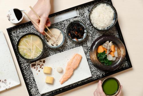 a tray of food with sushi and rice on a table at The Prince Akatoki London in London